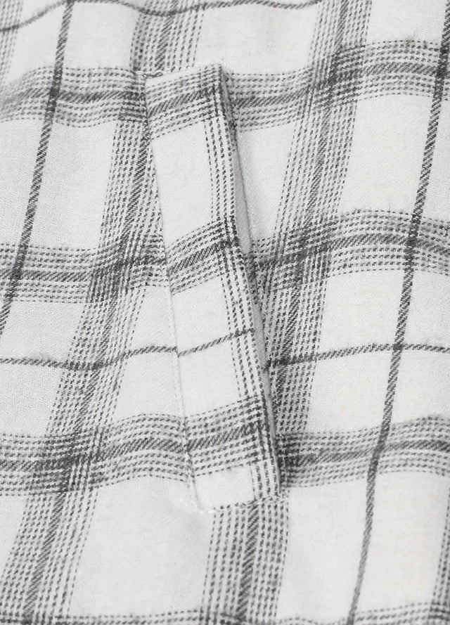 Close-up of womens sherpa-lined white flannel hooded hand pocket