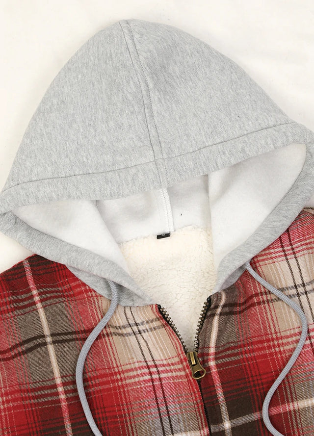 Close-up of the zipper detail on a women's red black plaid flannel jacket