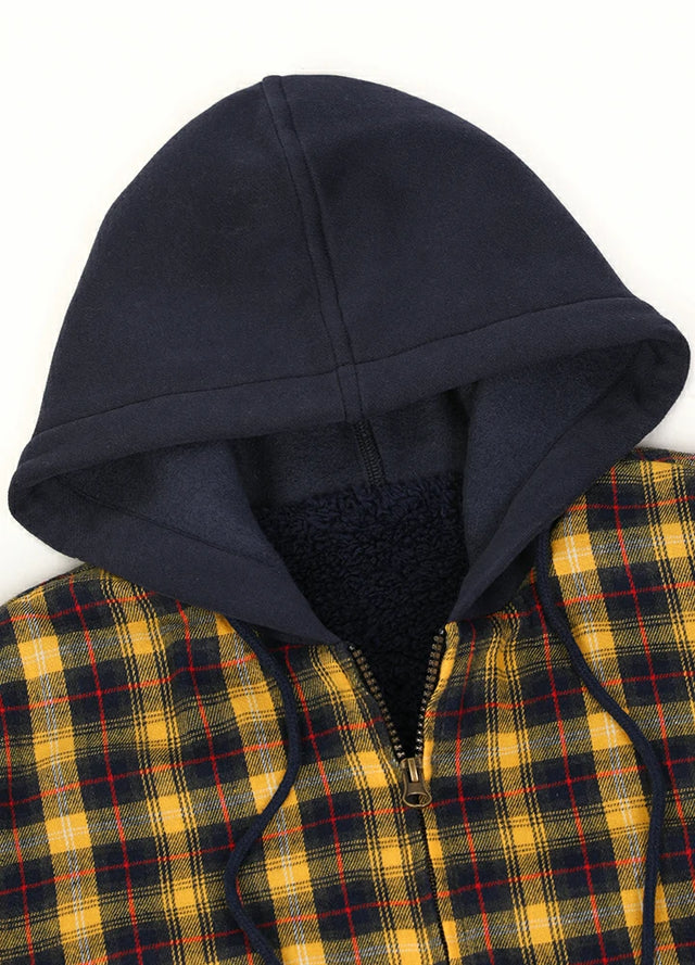 Close-up of the zipper detail on a women's yellow plaid flannel jacket