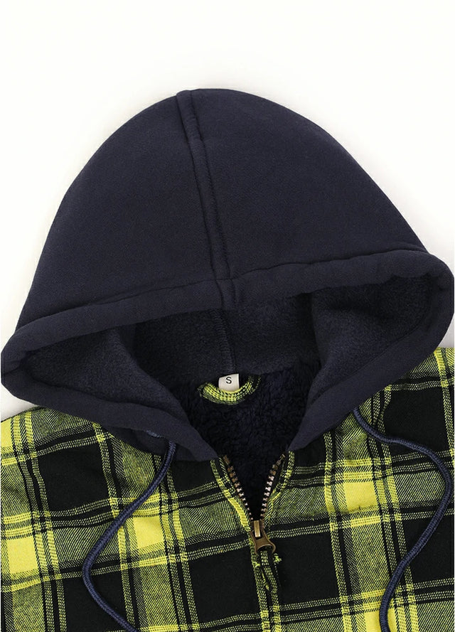 Close-up of the zipper detail on a women's yellow black plaid flannel jacket