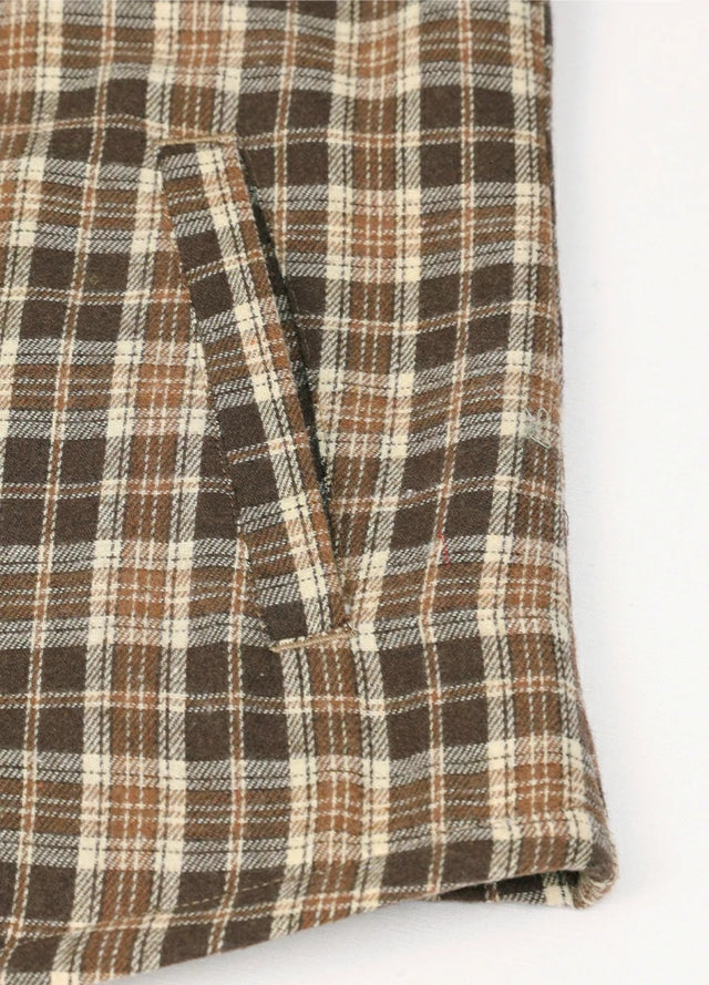 Close-up of womens sherpa-lined chocolate flannel hooded hand pocket