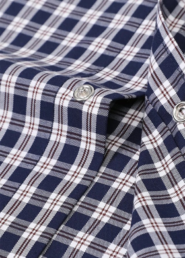 Close-up of the snap button of an indigo white men's classic western short sleeve shirt