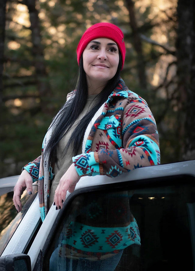 Side view of women in a brown blue soft warm fleece shirt jacket
