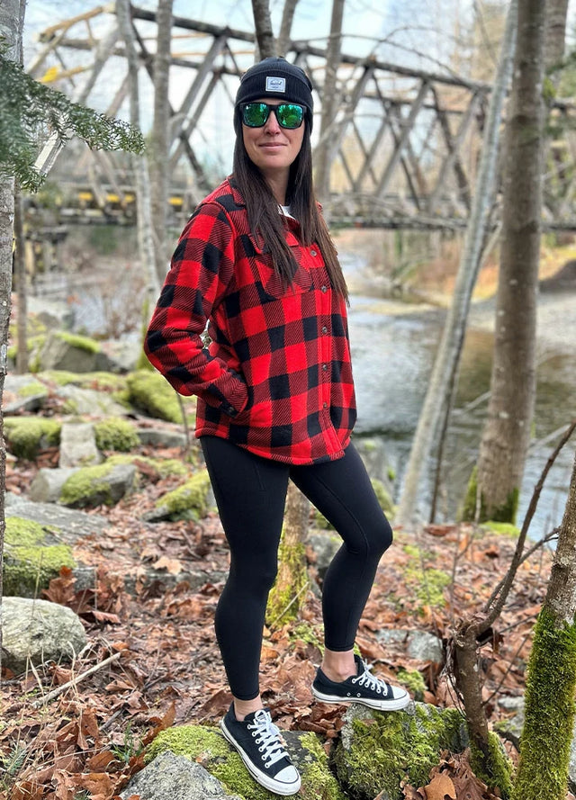 Side view of women in a red and black soft warm fleece shirt jacket