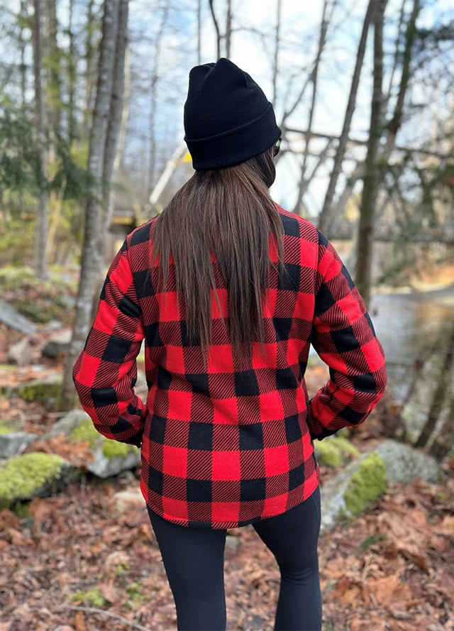 Back view of women in a red black winter sherpa-lined shirt jacket