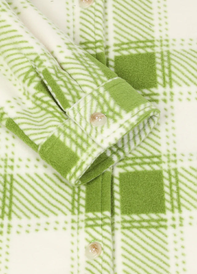 Detailed view of the cuffs on a womens green plaid fleece shirt jacket