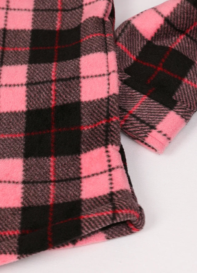 Close-up of a womens sherpa lined black pink fleece shacket hand pocket