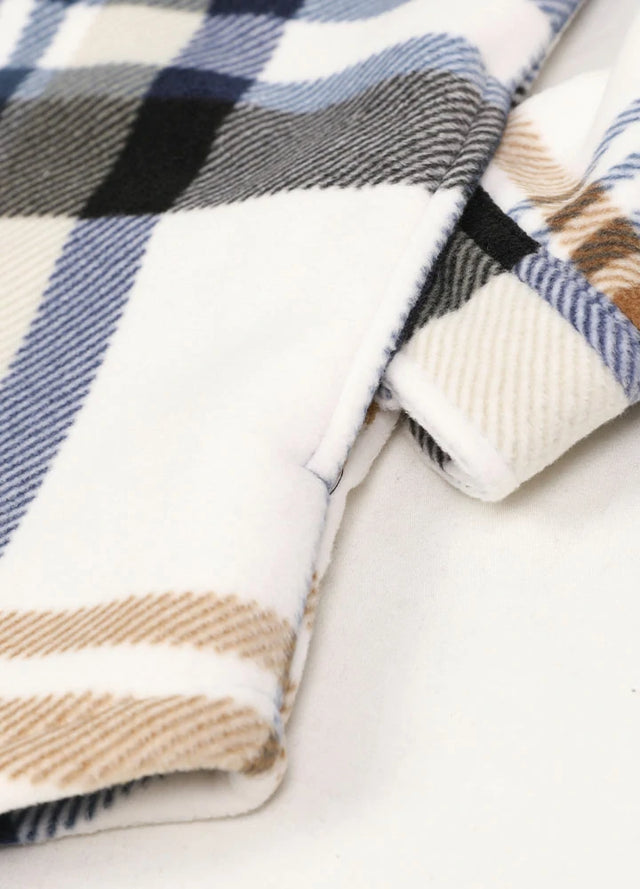 Close-up of a womens sherpa lined blue white fleece shacket hand pocket