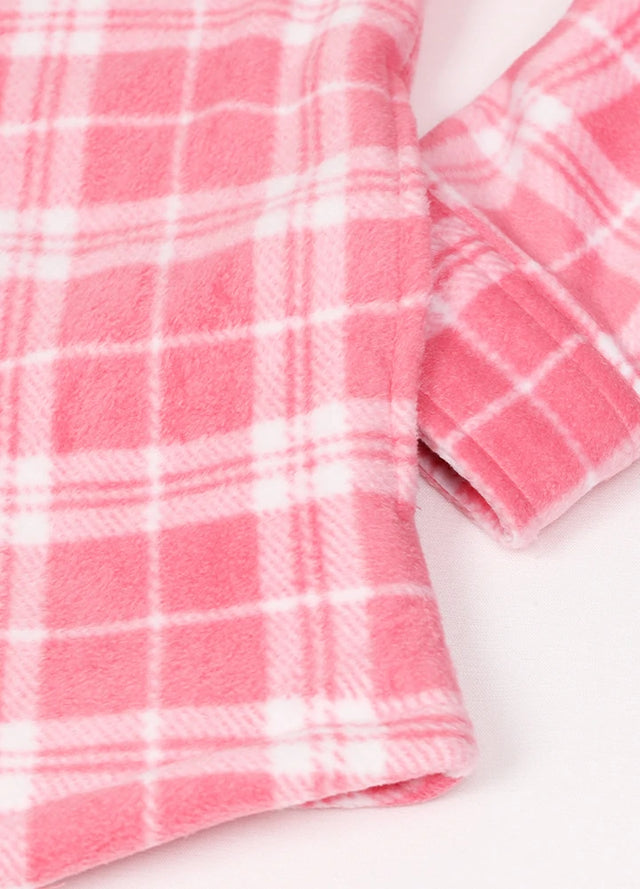 Close-up of a womens sherpa lined pink fleece shacket hand pocket
