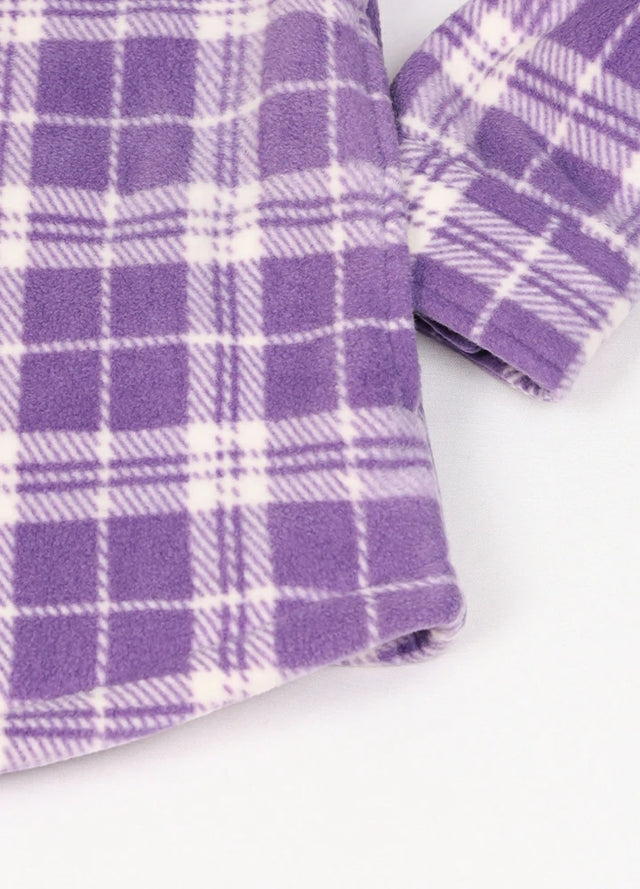 Close-up of a womens sherpa lined purple white fleece shacket hand pocket