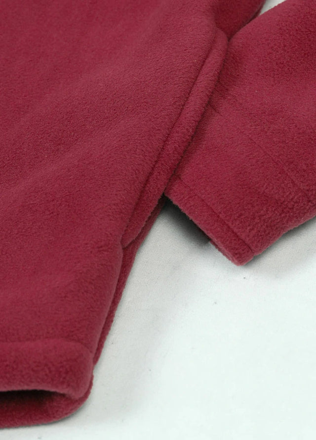 Close-up of a womens sherpa lined red fleece shacket hand pocket
