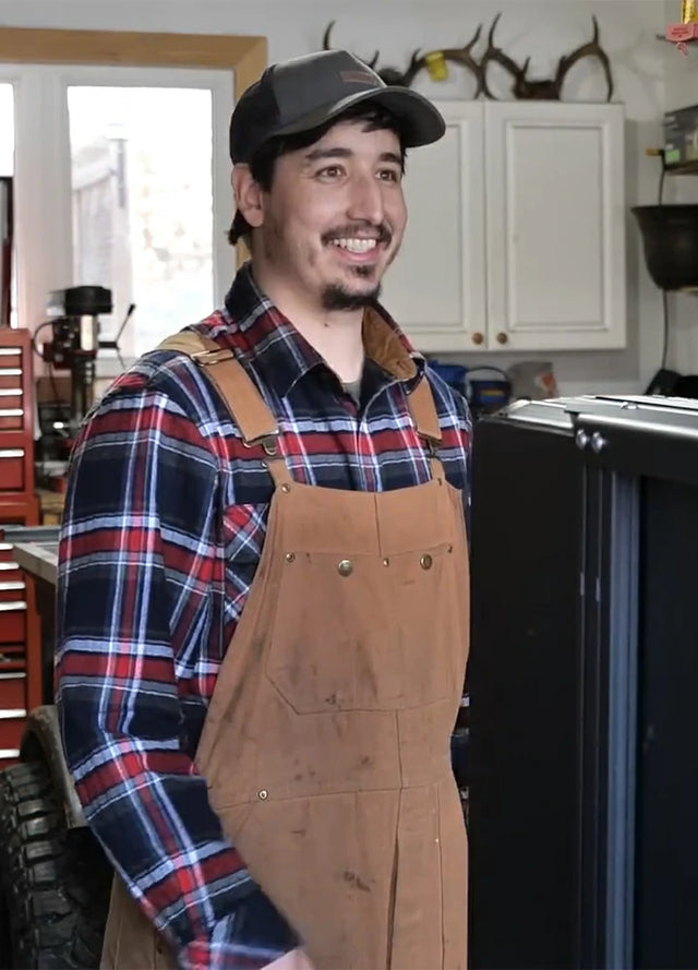 Front view of a man in a navy red men's cotton flannel shirt