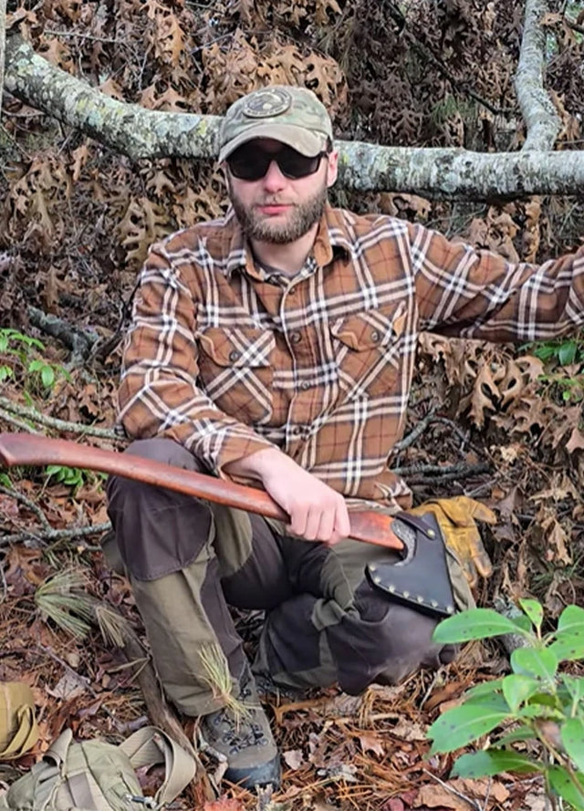 Front view of a man in a men's brown timberline cotton flannel shirt