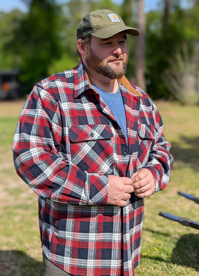 Front view of a man wearing a red and navy midweight cotton flannel shirt for men
