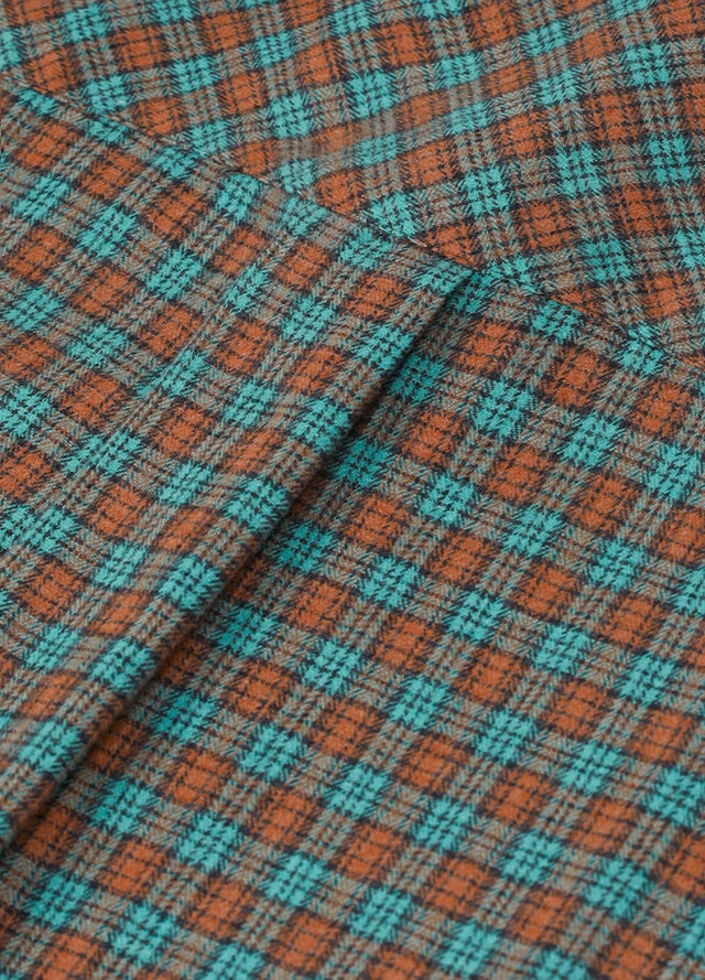 Close-up of women's soft pine green brown flannel plaid shirt back design
