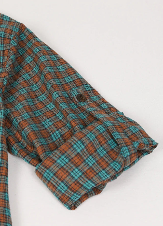 Zoomed-in of women's pine green brown plaid flannel shirt roll up cuffs