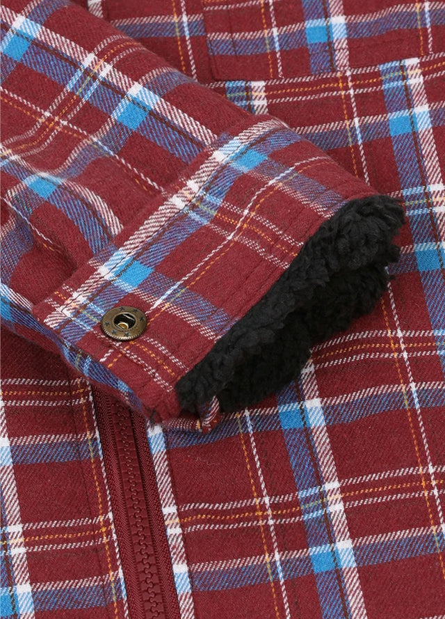 Detailed close-up of kid's red black flannel jacket with cuff