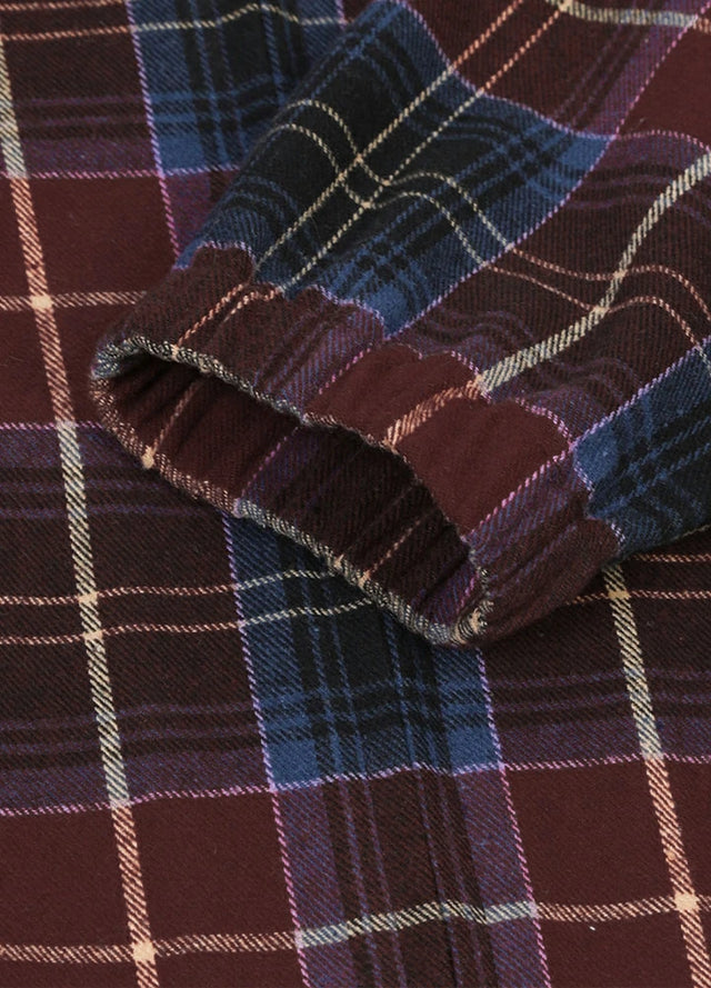 Close-up of the cuff of red blue men's cozy zip up plaid jacket