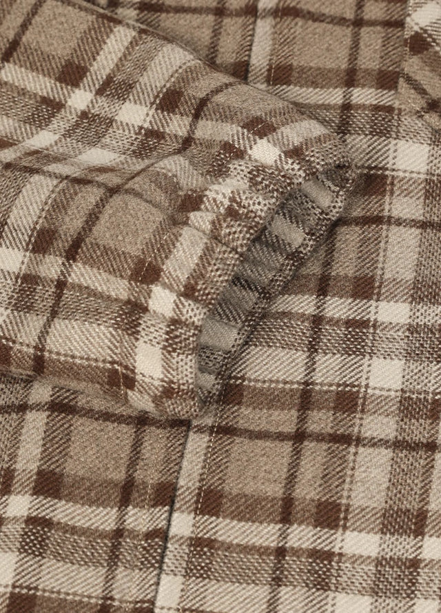 Close-up of the cuff of the coffee men's zip up plaid shirt jacket