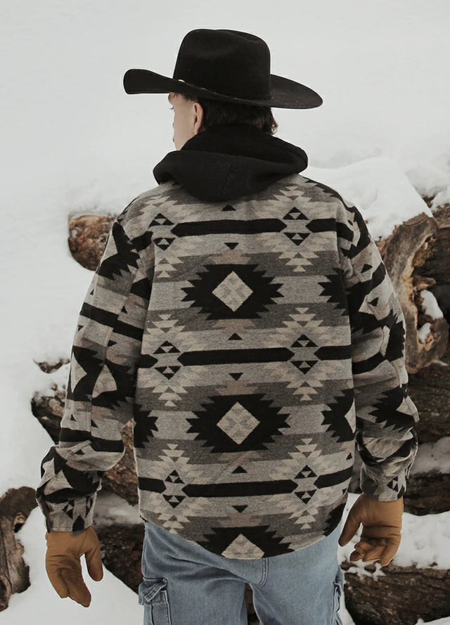 Back view of a man wearing a men's Aztec shirt jacket