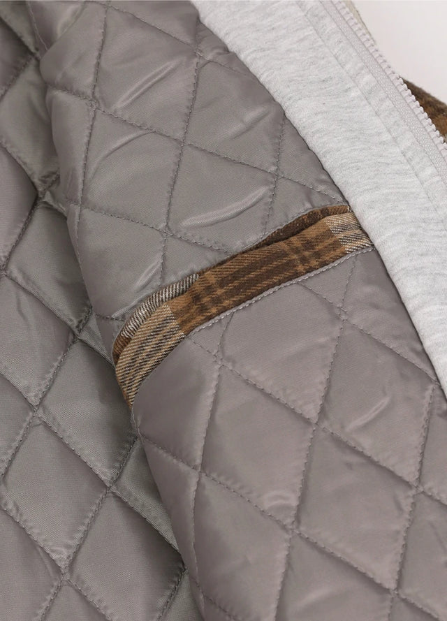 Detailed view of womens brown winter flannel jacket Inside pocket