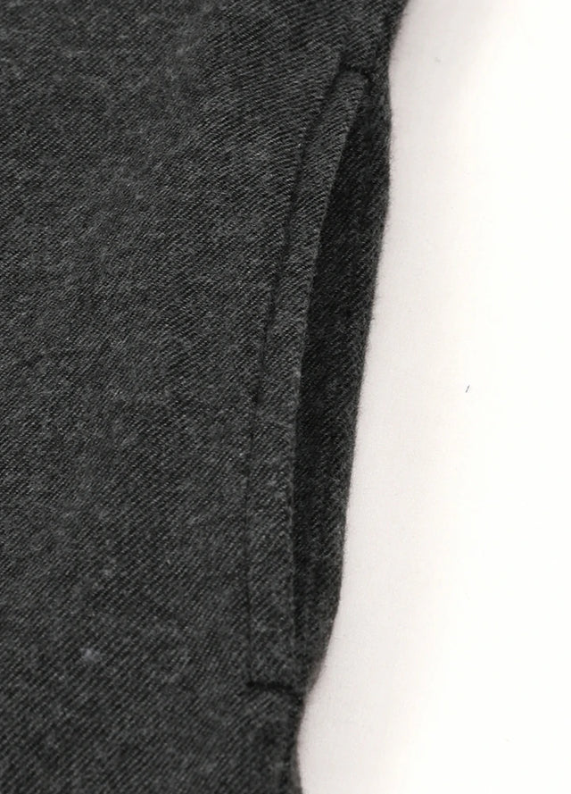 Detailed view of women's dark gray long sleeves flannel shacket side pocket