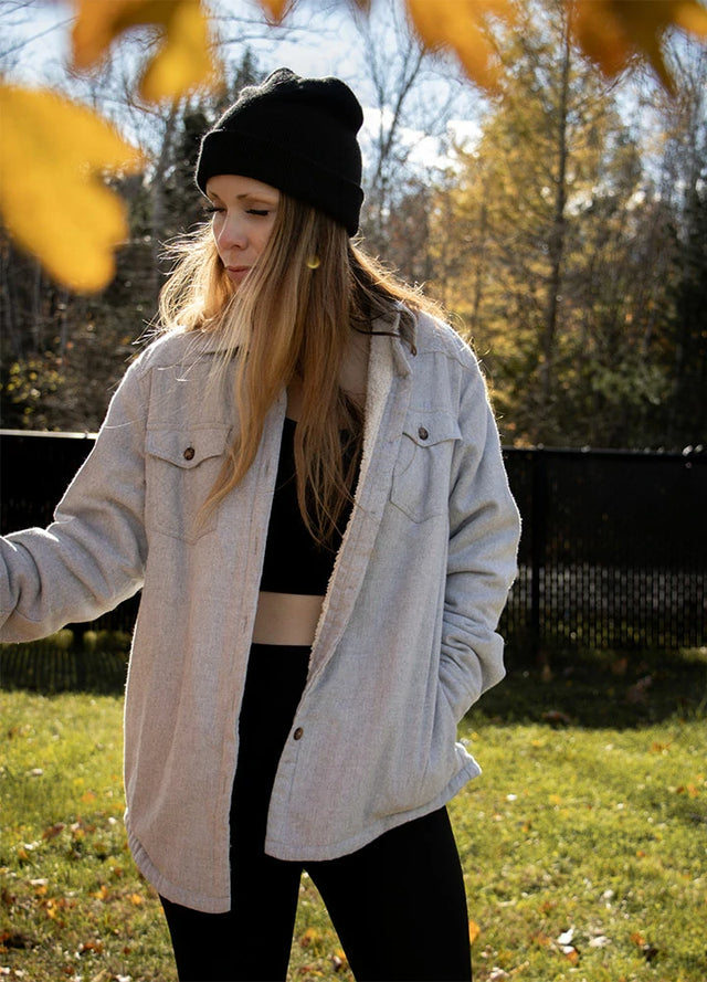 Women wearing a sherpa-lined warm solid gray flannel shirt jacket