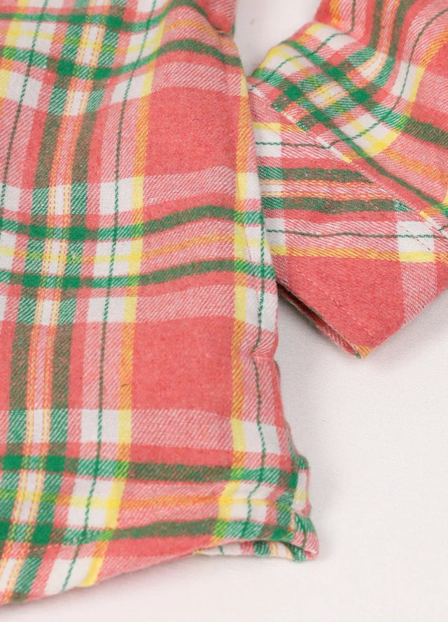 Detailed view of women's pink winter flannel shirt jacket side pocket