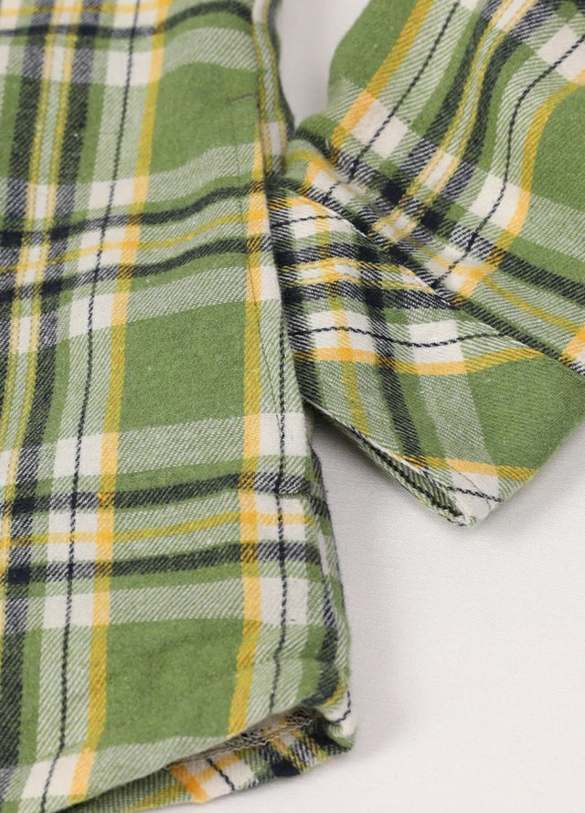 Close-up of the hand pocket on a women's sherpa-lined forest green flannel shirt jacket
