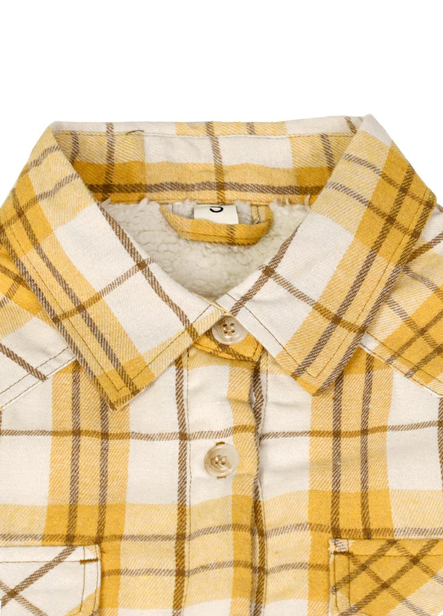 Close-up of the collar on a women's sherpa-lined khaki yellow flannel shirt jacket