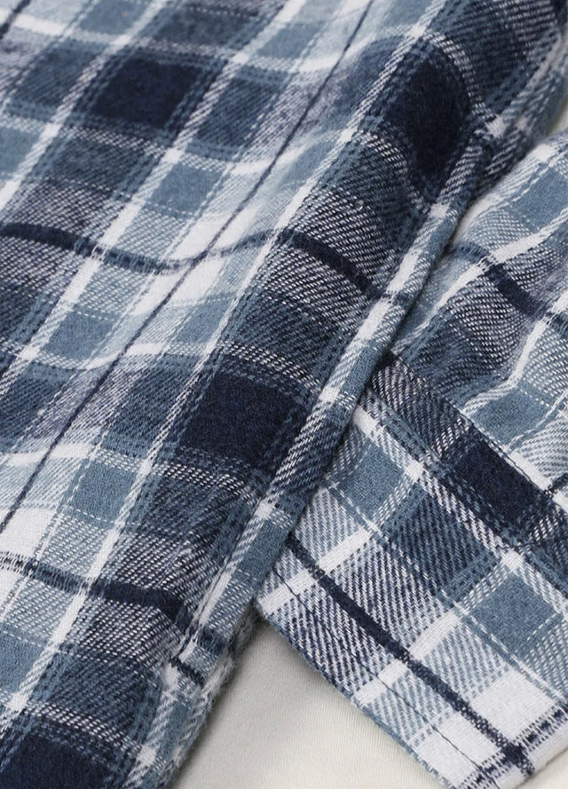 Close-up of boys blue and white flannel jacket exterior fabric
