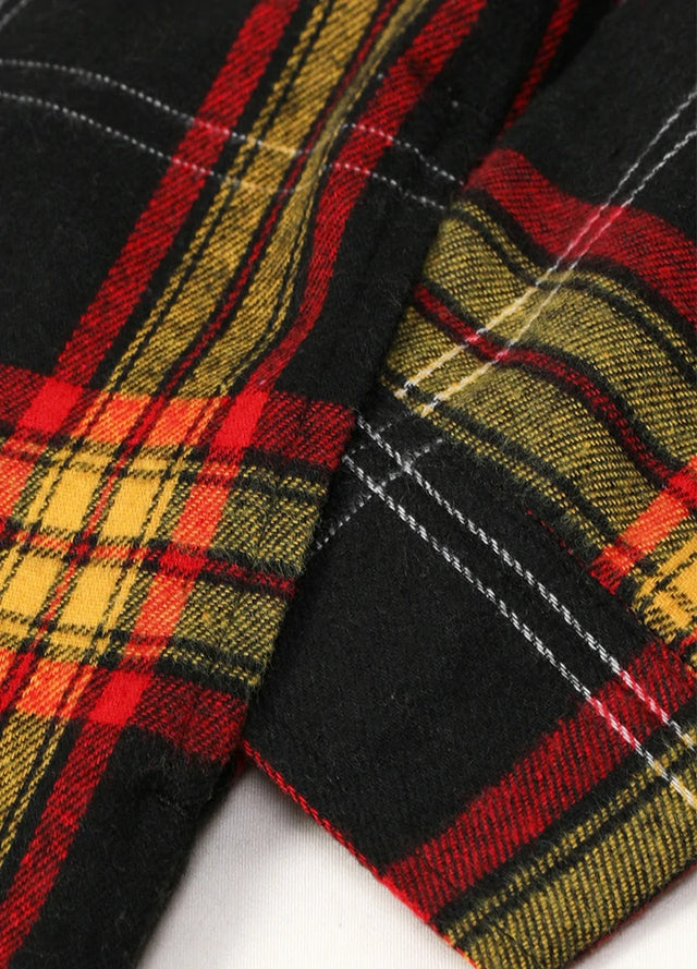 Close-up of boys yellow black flannel jacket exterior fabric