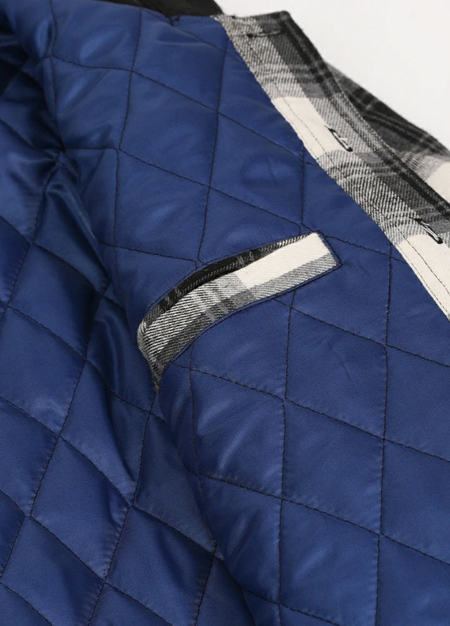 Close-up of the inner pocket of the black white men's outdoor button up hooded jacket