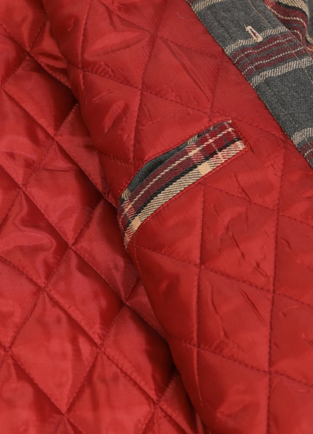 Close-up of the inner pocket of the red gray men's button up plaid hooded jacket