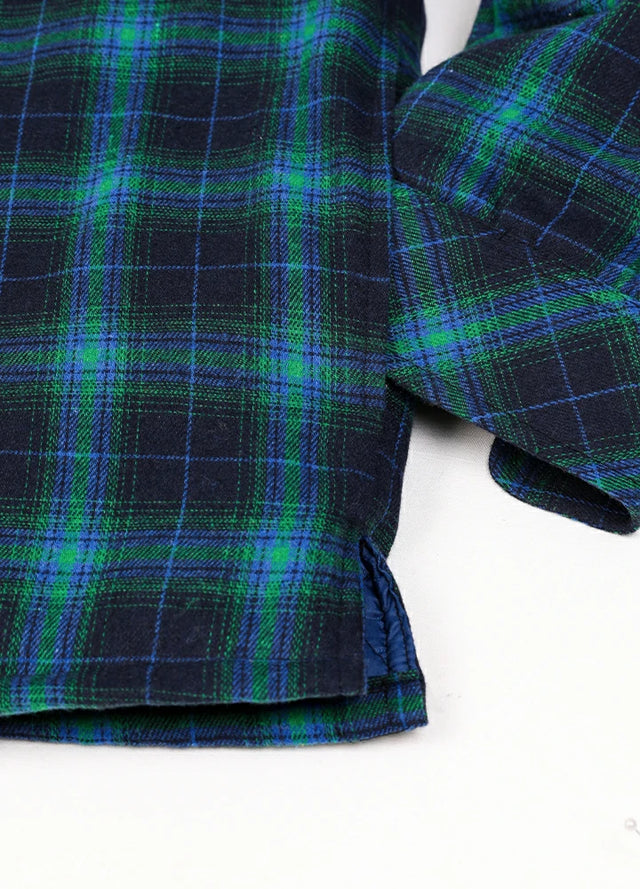 Close-up of the hand pocket of a Navy and Green cozy quilted lined plaid hooded jacket for men