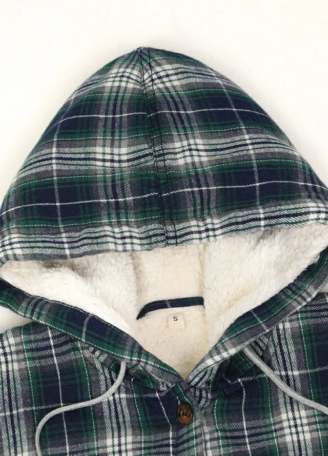 Close-up of the collar on a women’s dark green plaid flannel hooded jacket