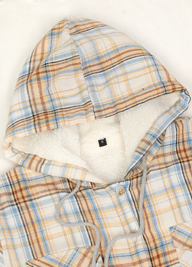 Close-up of the collar on a women’s khaki plaid flannel hooded jacket