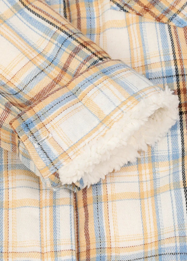 Detailed view of the cuffs on a women’s khaki button-down flannel jacket