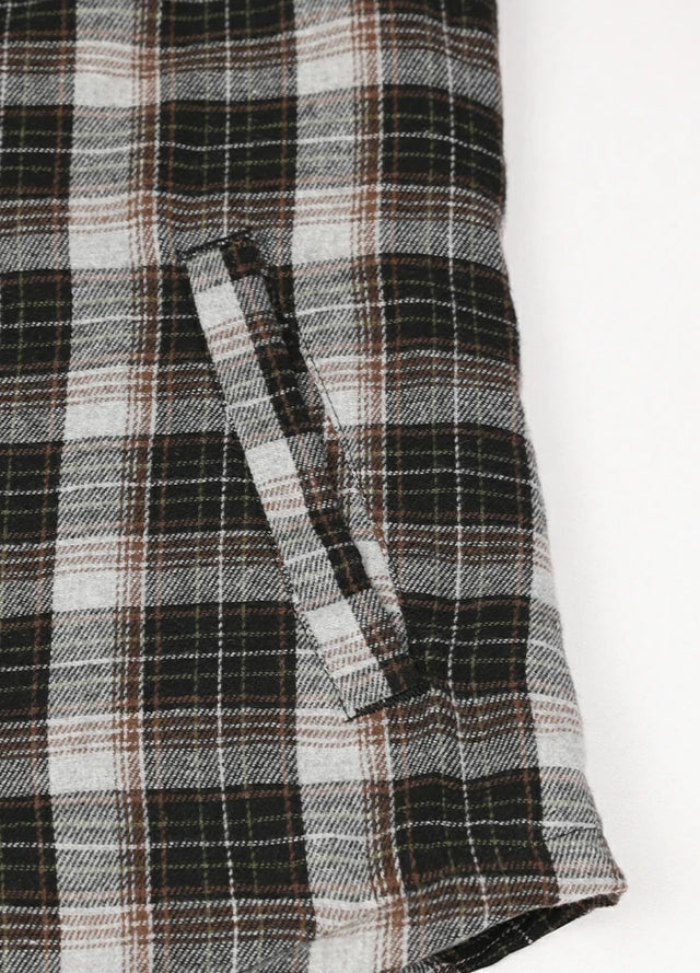 Close-up of the hand pocket of a black khaki women's cozy sherpa lined hooded plaid jacket