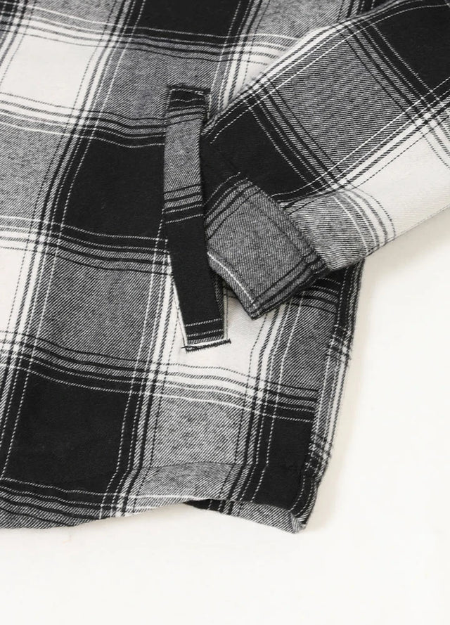 Close-up of the hand pocket of the black white men's cozy snap button flannel shirt jacket