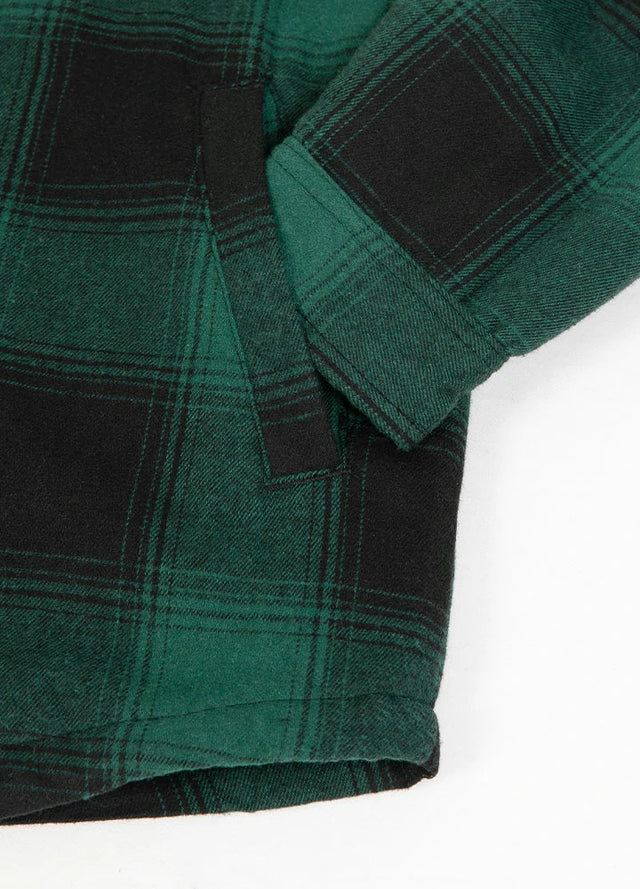 Close-up of the hand pocket of men's green black soft snap button flannel jacket