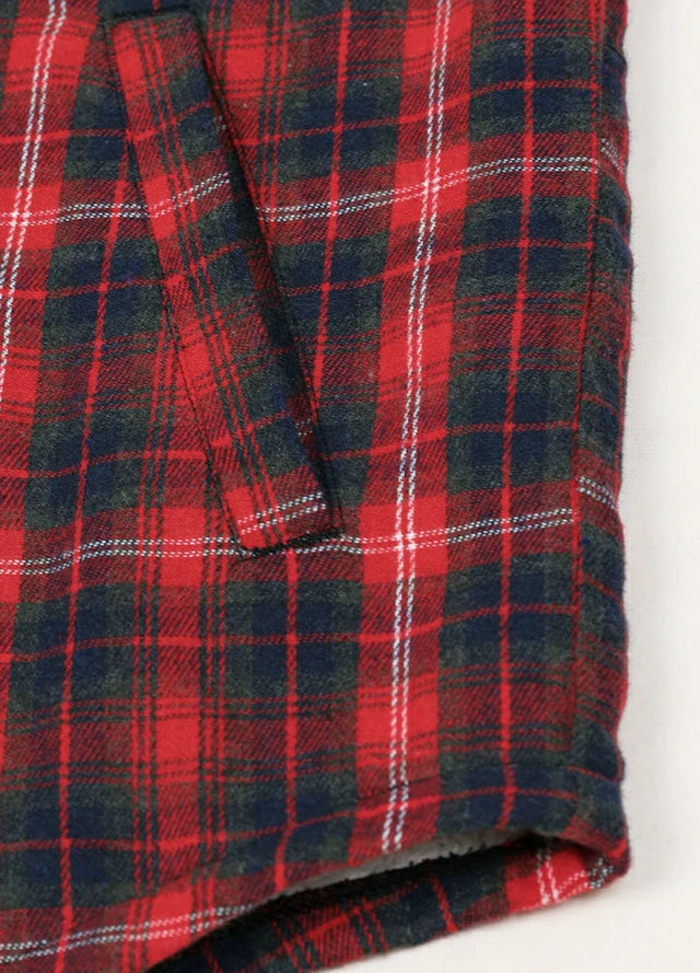 Detailed view of the hand pocket of the red men's warm sherpa-lined jacket with removable hood