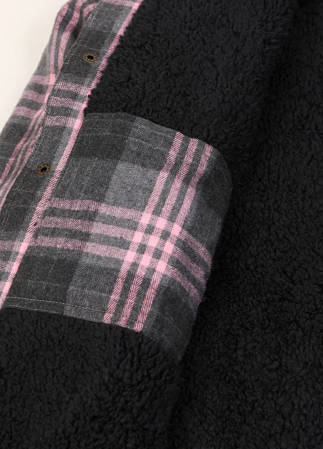 Close-up of the inner pocket of the pink men's sherpa lined jacket with removable hood