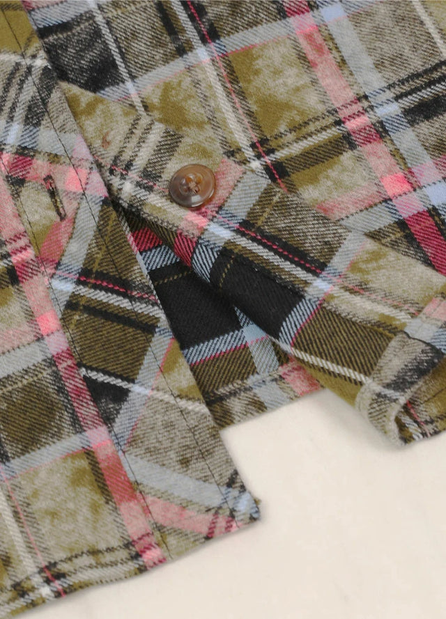 Zoomed-in view of the hem on a Women's flannel dark green plaid shirt with chest pocket