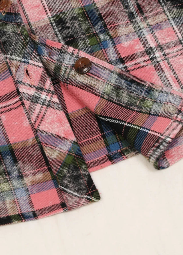 Zoomed-in view of the hem on a Women's flannel pink plaid shirt with chest pocket