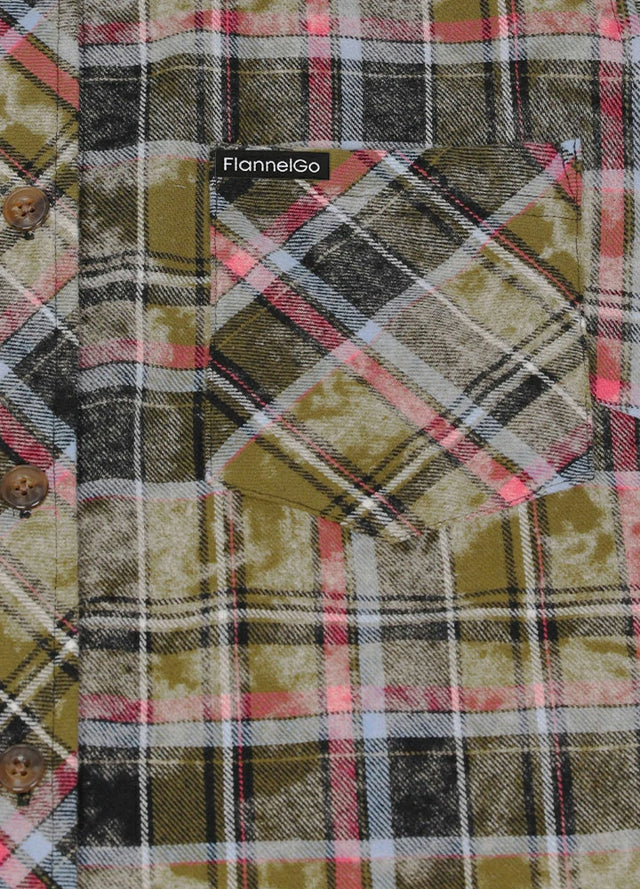 Close-up of the chest pocket on a long sleeves dark green plaid flannel shirt