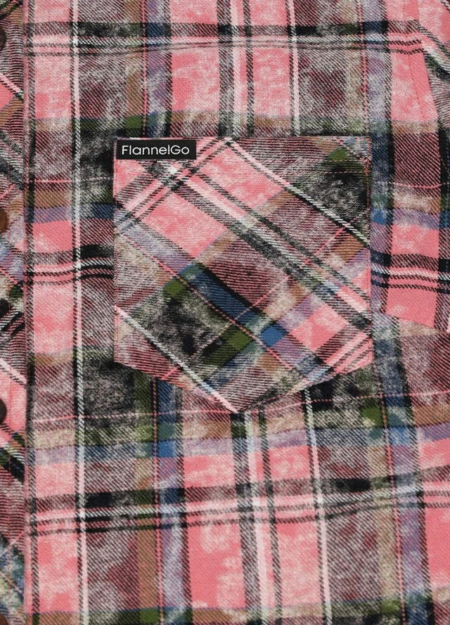 Close-up of the chest pocket on a long sleeves pink plaid flannel shirt