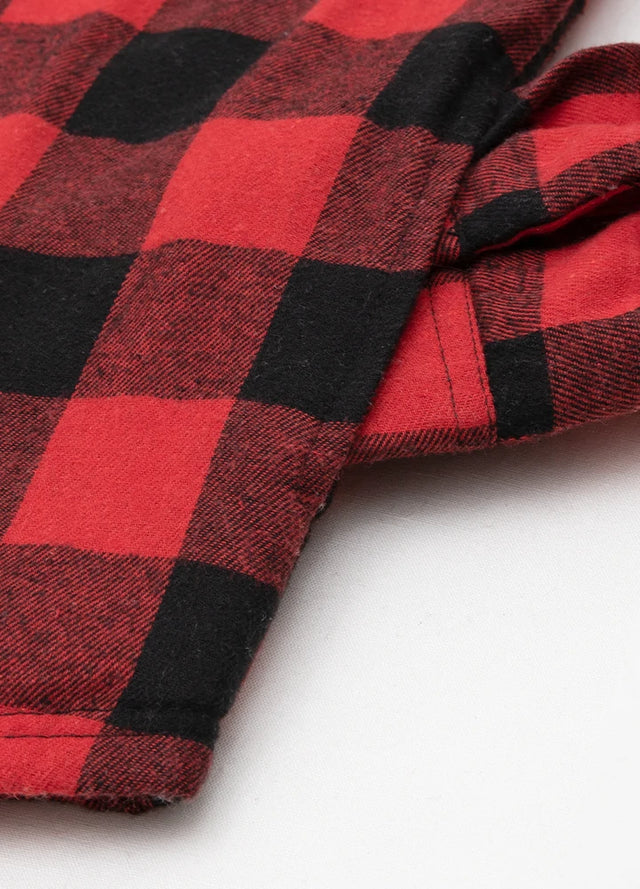 Close-up detail of the Two side pockets on a boys' hooded plaid flannel shirt jacket