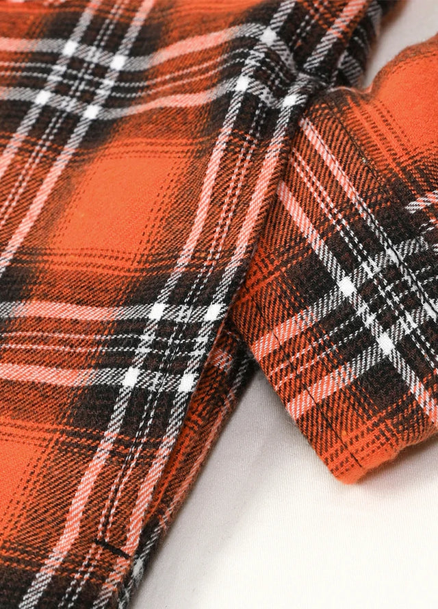 Close-up of kids orange black flannel jacket with hand pocket