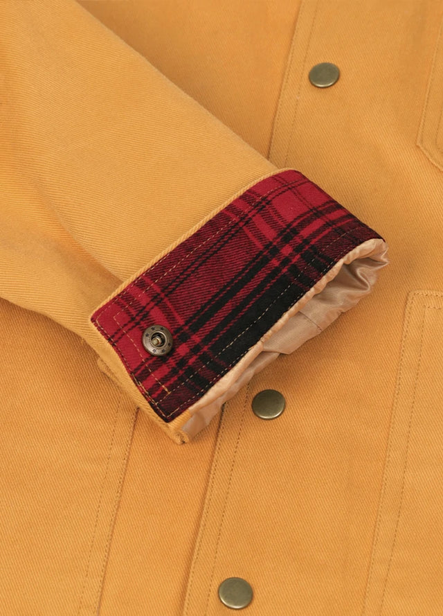 Close-up of cuff of the yellow men's casual flannel lined jacket